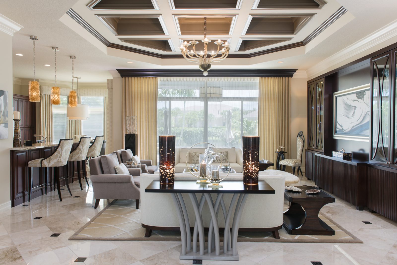 Maura Rossi, an accomplished interior designer, standing in a stylishly decorated living room she designed, exemplifying her elegant and innovative aesthetic.