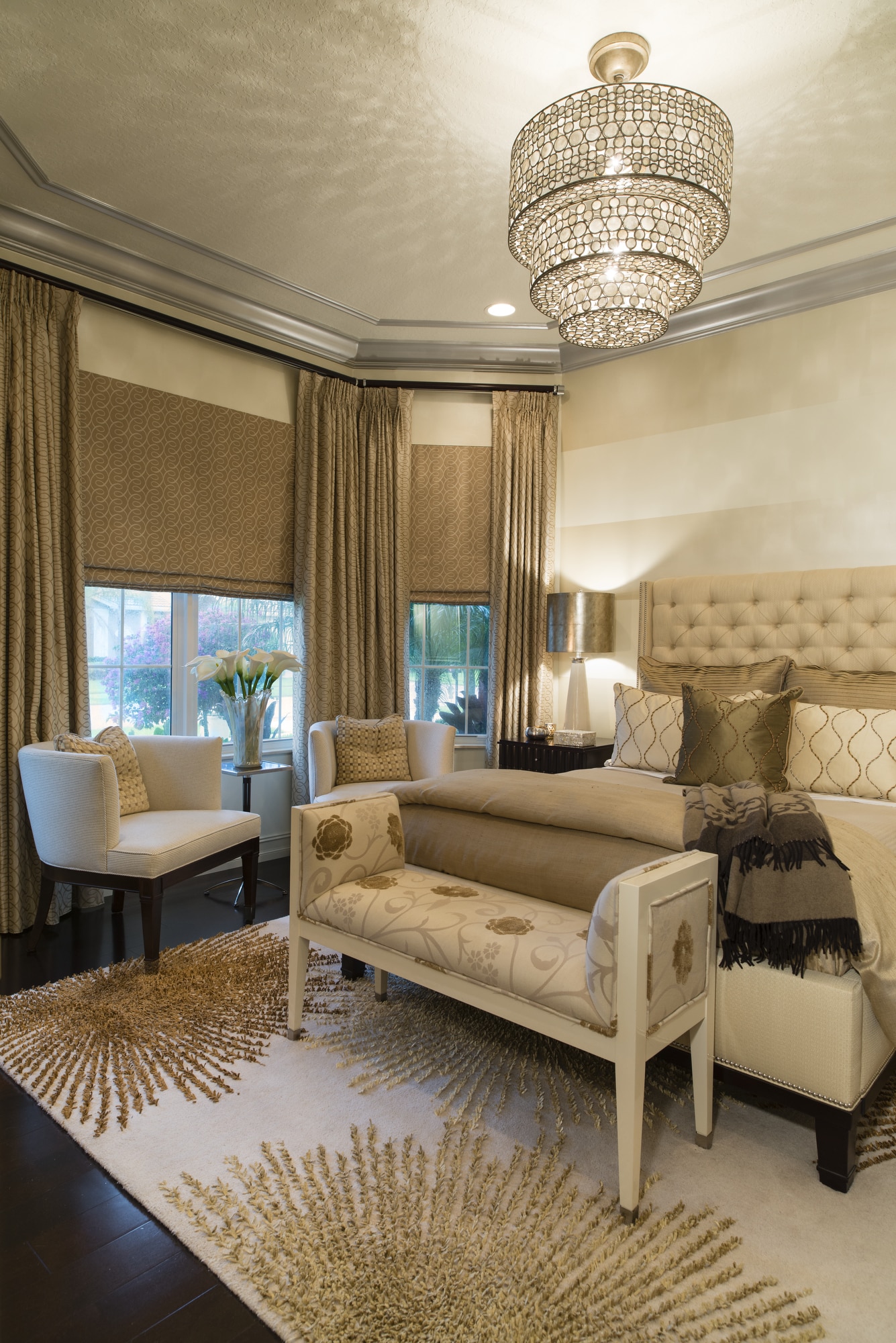 Maura Rossi, an accomplished interior designer, standing in a stylishly decorated living room she designed, exemplifying her elegant and innovative aesthetic.