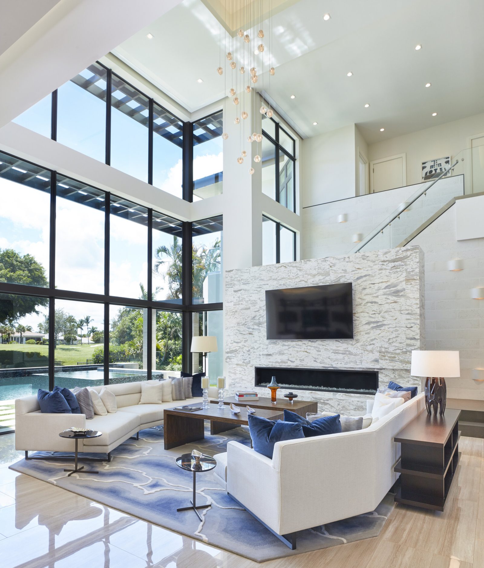 Gage Hartung, a professional and focused interior designer, reviewing blueprints and fabric samples in his well-organized office, surrounded by elegant and modern design elements.