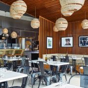 Main dining room of The Alley restaurant at The Betsy Hotel Miami Beach with modern Italian design and ambient lighting.