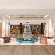 Redesigned lobby at Ocean Key Resort & Spa featuring a sculptural fountain, tropical décor, and pastel tones inspired by Key West.