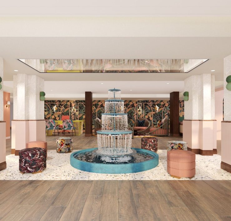 Redesigned lobby at Ocean Key Resort & Spa featuring a sculptural fountain, tropical décor, and pastel tones inspired by Key West.