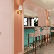 Sweet Bird Bar at Ocean Key Resort featuring coral arches, turquoise bar counters, and artistic lighting.