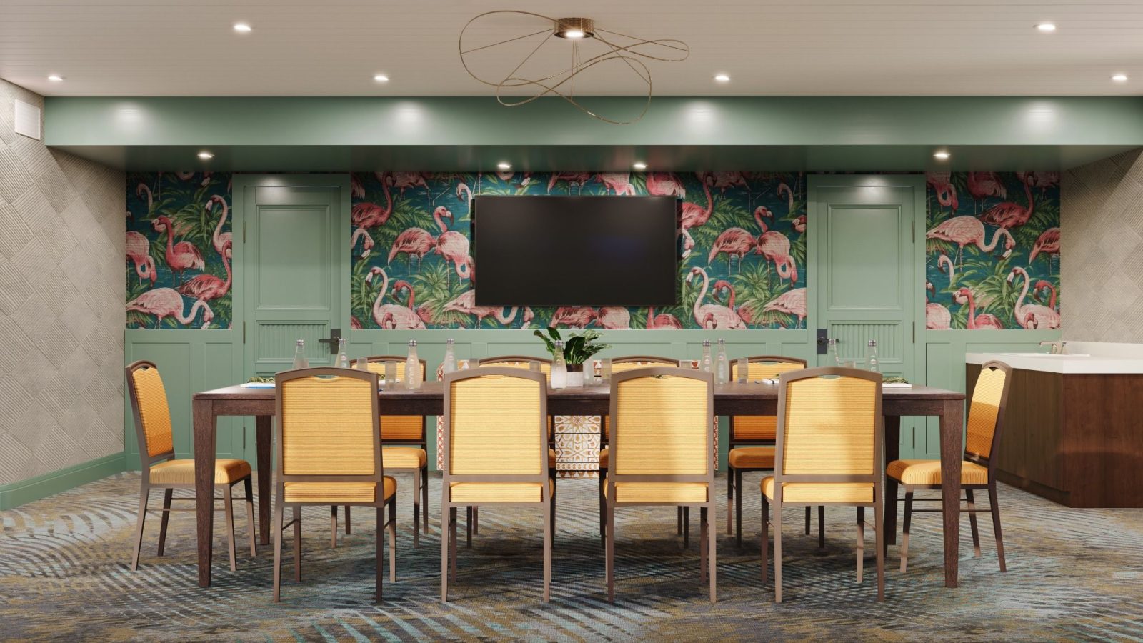 White Ibis Boardroom at Ocean Key Resort featuring flamingo wallpaper and elegant seating for meetings with ocean views.