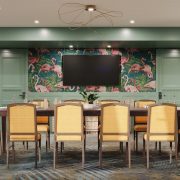 White Ibis Boardroom at Ocean Key Resort featuring flamingo wallpaper and elegant seating for meetings with ocean views.