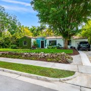 Exterior view of the tropical Art Deco home by Victor Nellenbogen in Belle Meade, surrounded by lush greenery.