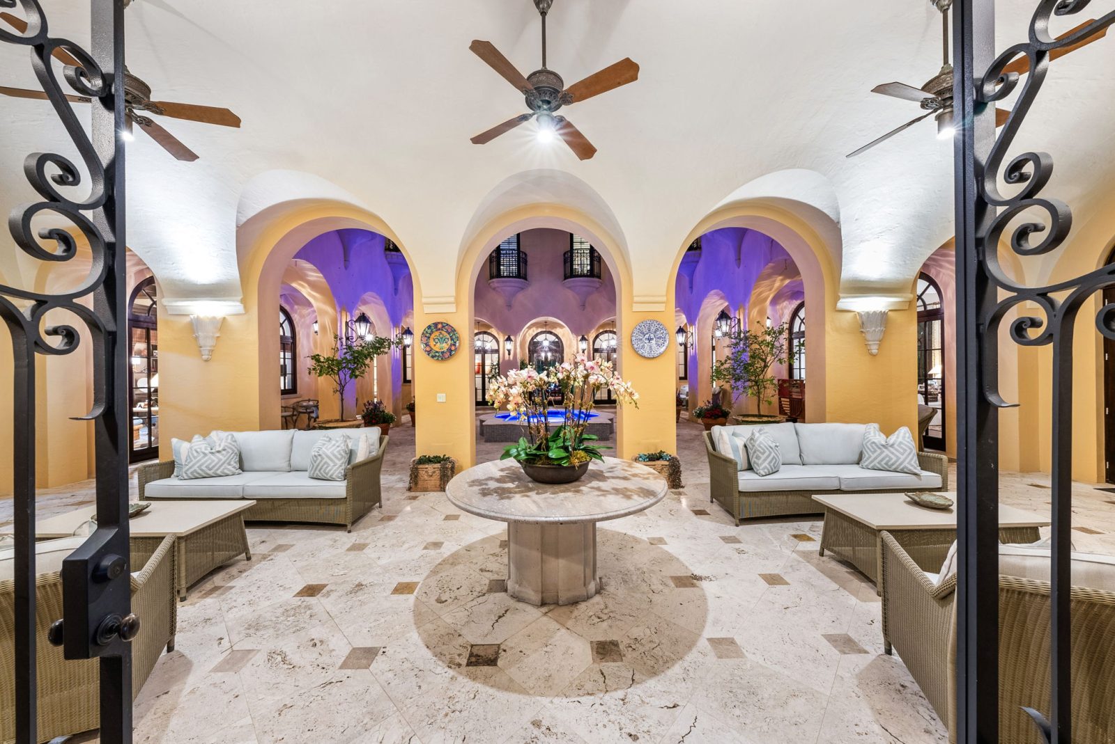 Interior living room with vaulted ceilings, arched walkways, and elegant seating inside Armando Codina’s Coral Gables residence.