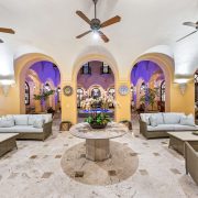 Interior living room with vaulted ceilings, arched walkways, and elegant seating inside Armando Codina’s Coral Gables residence.