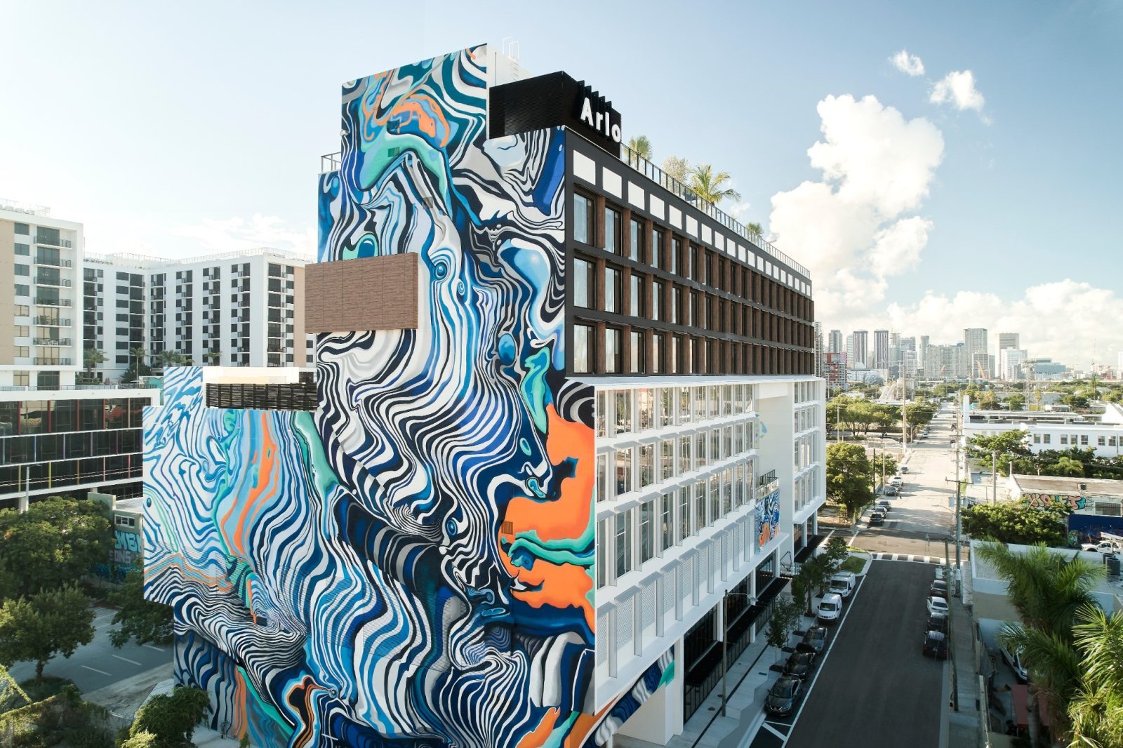 Arlo Wynwood hotel exterior featuring large-scale colorful murals in Miami’s art district.
