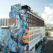 Arlo Wynwood hotel exterior featuring large-scale colorful murals in Miami’s art district.