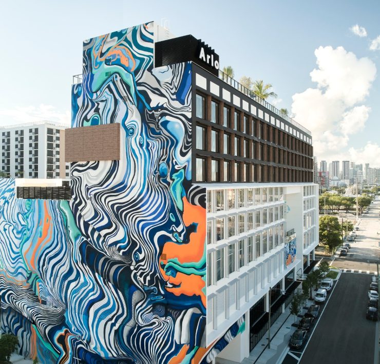 Arlo Wynwood hotel exterior featuring large-scale colorful murals in Miami’s art district.