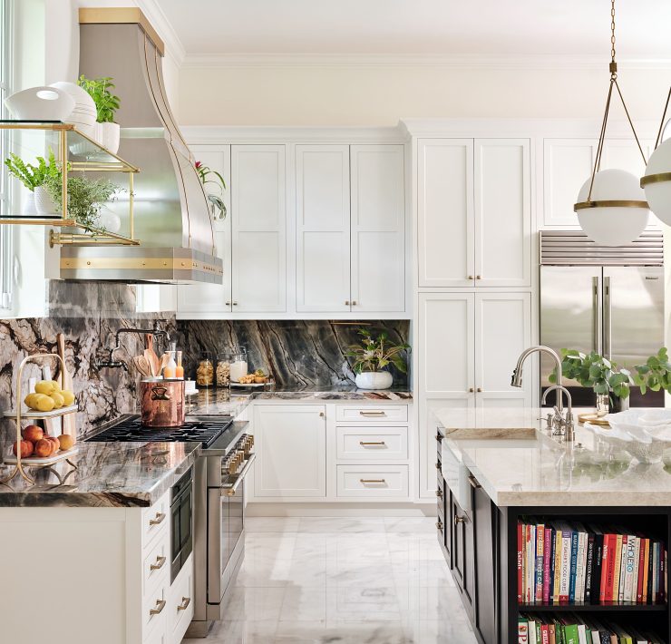 Modern white kitchen with marble backsplash, pendant lighting, and open shelving design.