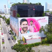 Aerial view of Wynwood district with Messi mural and colorful street art in Miami.