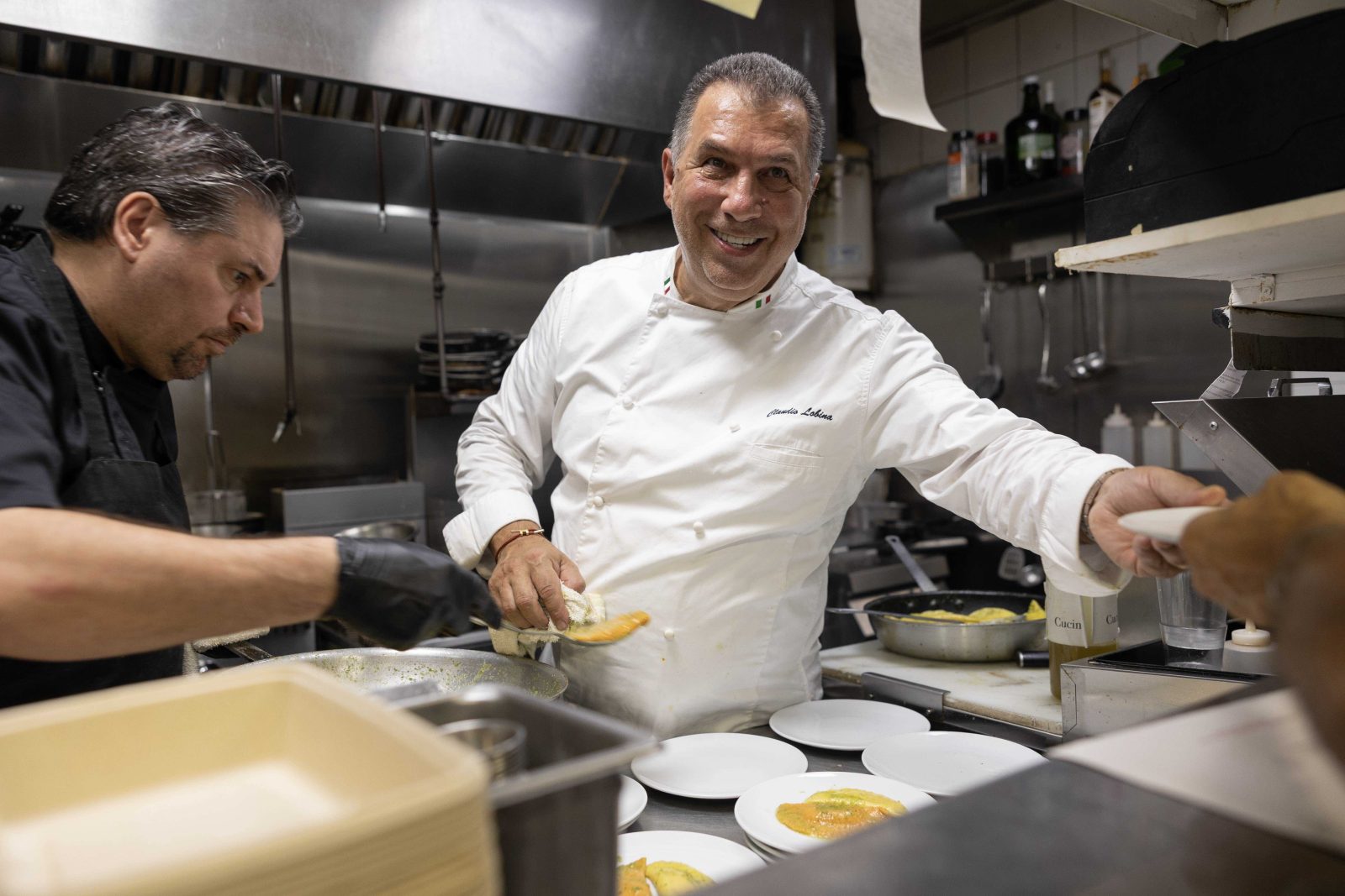 Chef Claudio Lobina preparing gourmet Mediterranean dishes at The Patio restaurant, Continuum Miami Beach.