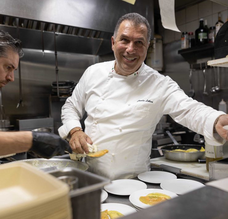 Chef Claudio Lobina preparing gourmet Mediterranean dishes at The Patio restaurant, Continuum Miami Beach.
