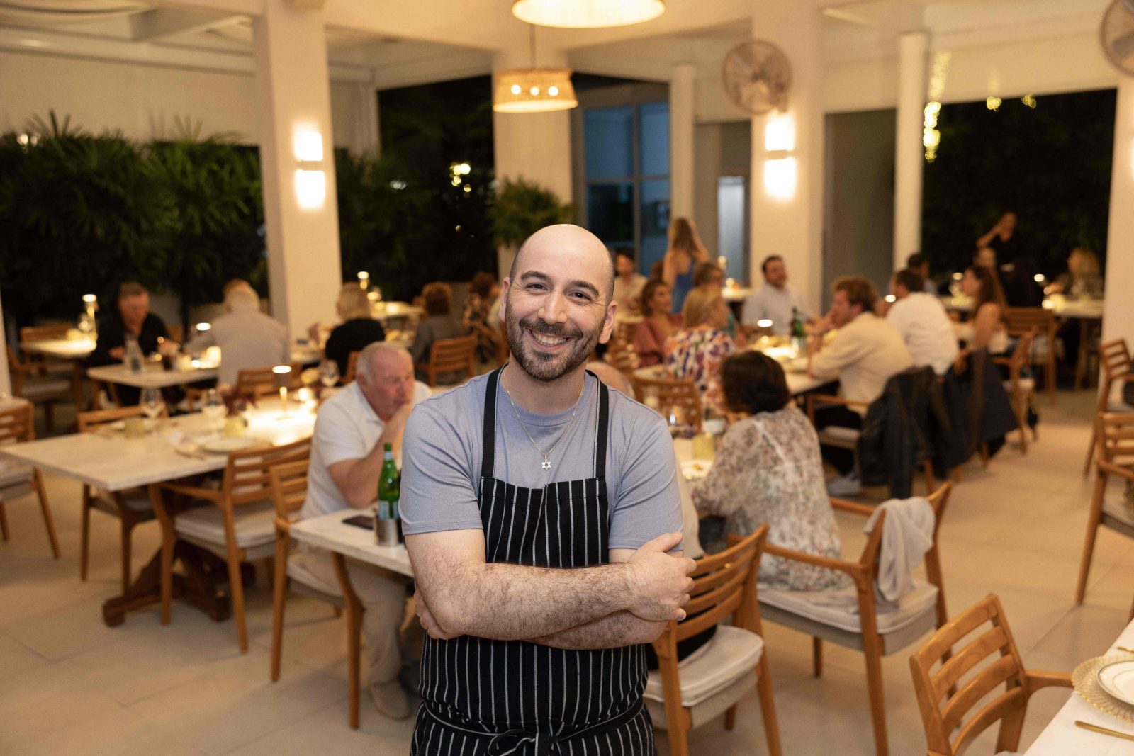 Chef Sam Levenfeld of K’Far Brooklyn with Continuum residents during private dinner event at The Patio, Miami Beach.