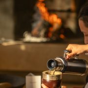Guest preparing and serving mate tea during a cultural ritual at SB Winemaker’s House in Mendoza.