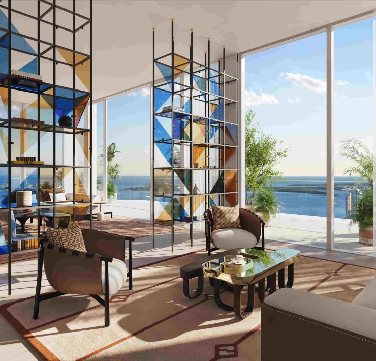 Living room at JEM Sky Villa featuring ocean views and the FENDI Casa Matrice bookcase in a modern open layout.
