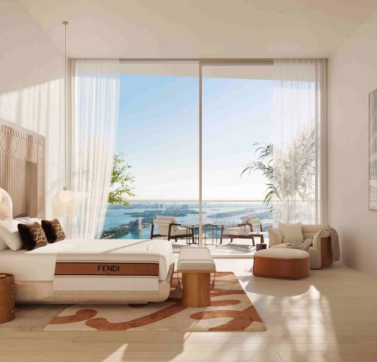 Primary bedroom at JEM Sky Villa with floor-to-ceiling windows, FENDI Casa furnishings and Biscayne Bay views.