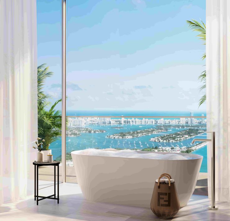 Luxury bathroom with freestanding tub and expansive skyline and bay views at JEM Sky Villa in Miami.