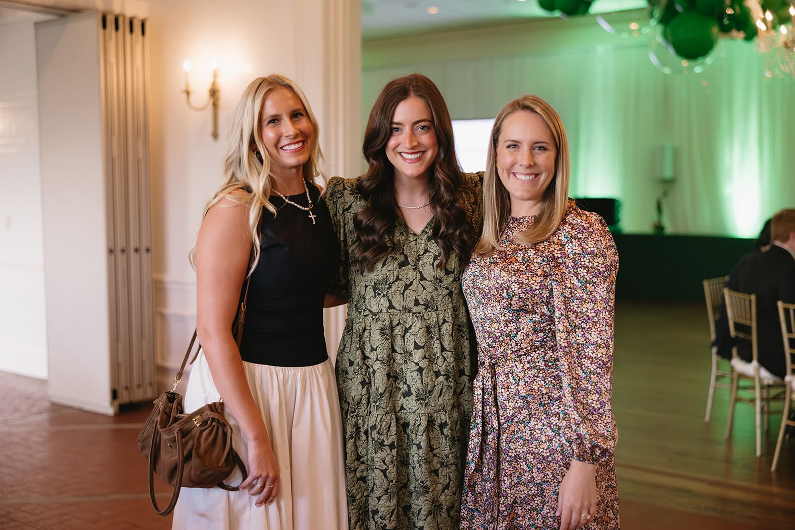 Guests posing for a photo at the Both Ends Believing “Around the World” Gala celebrating global child welfare.