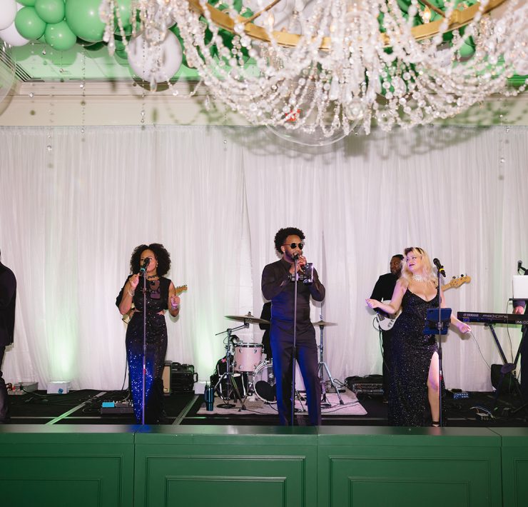 Live band performing at Both Ends Believing’s “Around the World” Gala at Brook Hollow Country Club.