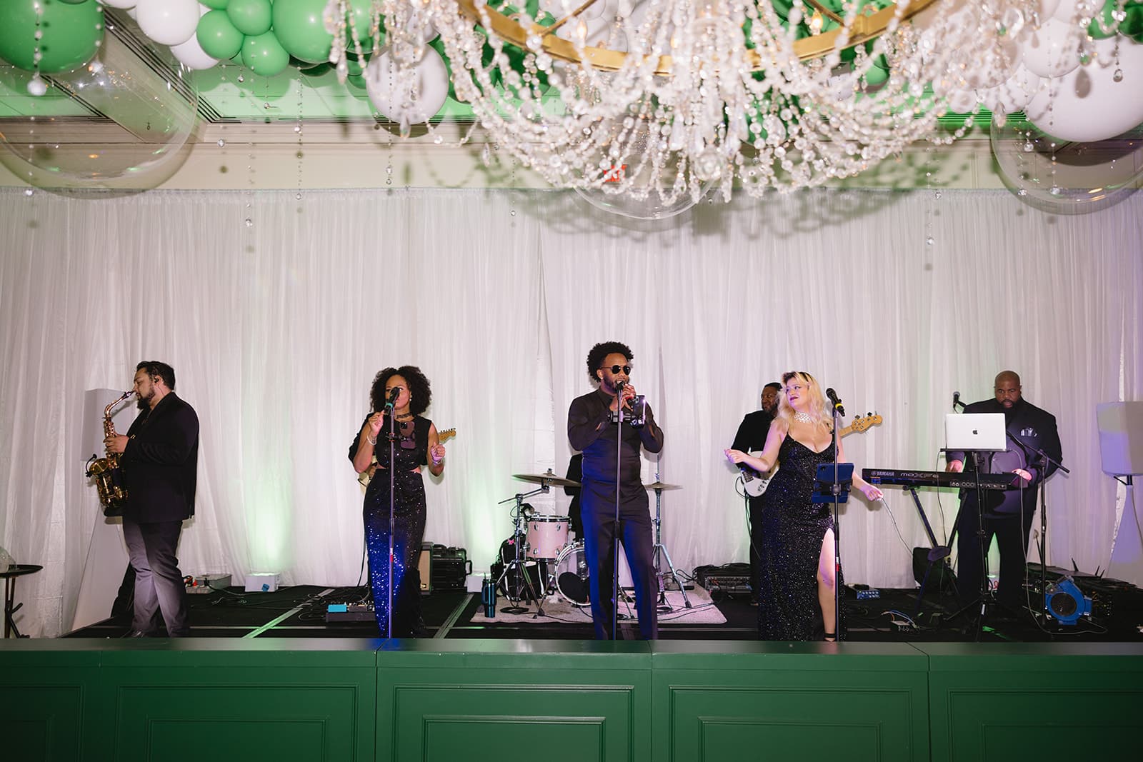 Live band performing at Both Ends Believing’s “Around the World” Gala at Brook Hollow Country Club.