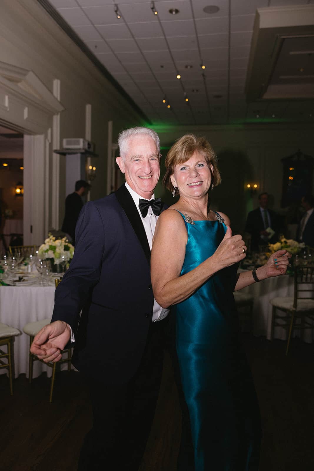 Elegant couple celebrating and dancing at Both Ends Believing’s “Around the World” Gala.