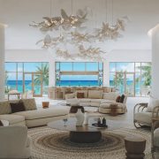 Luxury living room with panoramic ocean views and natural light at Nikki Beach Residences Antigua.