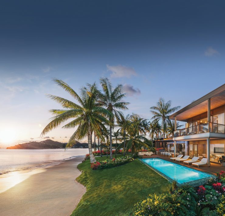 Private beachfront villa with infinity pool and palm-lined coastline at Nikki Beach Antigua.