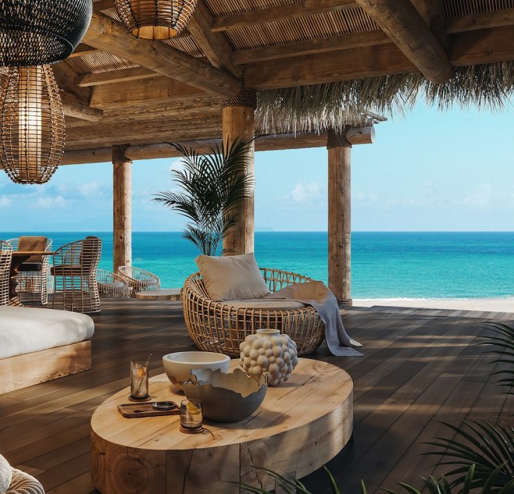 Oceanfront terrace with natural wood design and sea views at The Residences at Nikki Beach Resort & Spa Antigua.