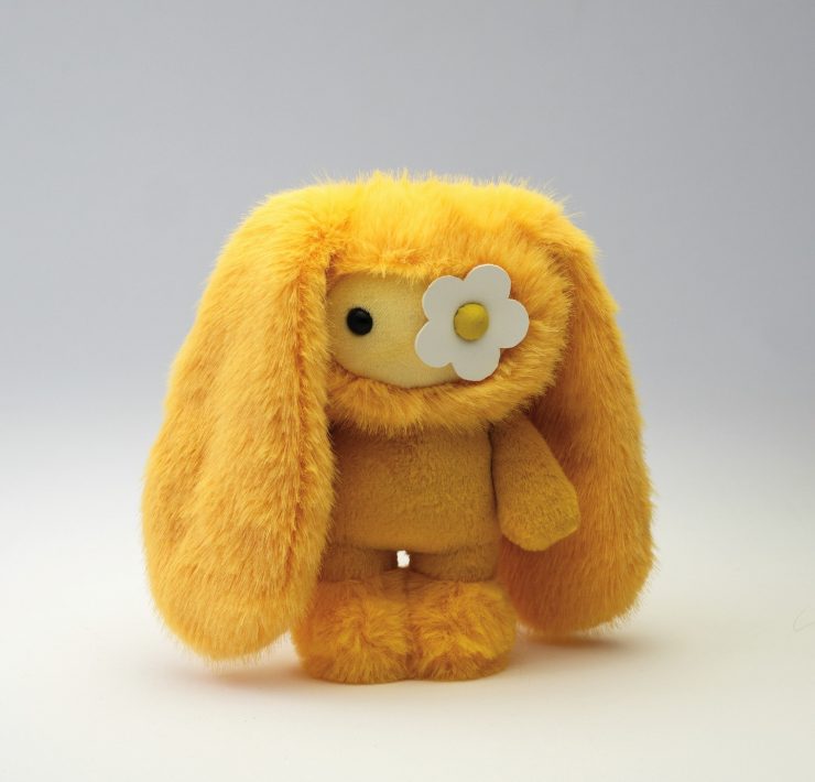 Yellow juju collectible by Cj Hendry for Phillips Hong Kong art toy collection