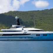 Luxury yacht SCOTT FREE cruising in the Caribbean, showcasing its sleek design and world-class charter amenities.