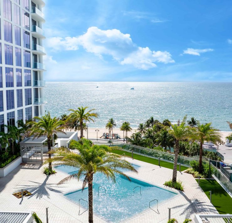 Selene Oceanfront Residences pool terrace overlooking Fort Lauderdale Beach and the Atlantic Ocean.