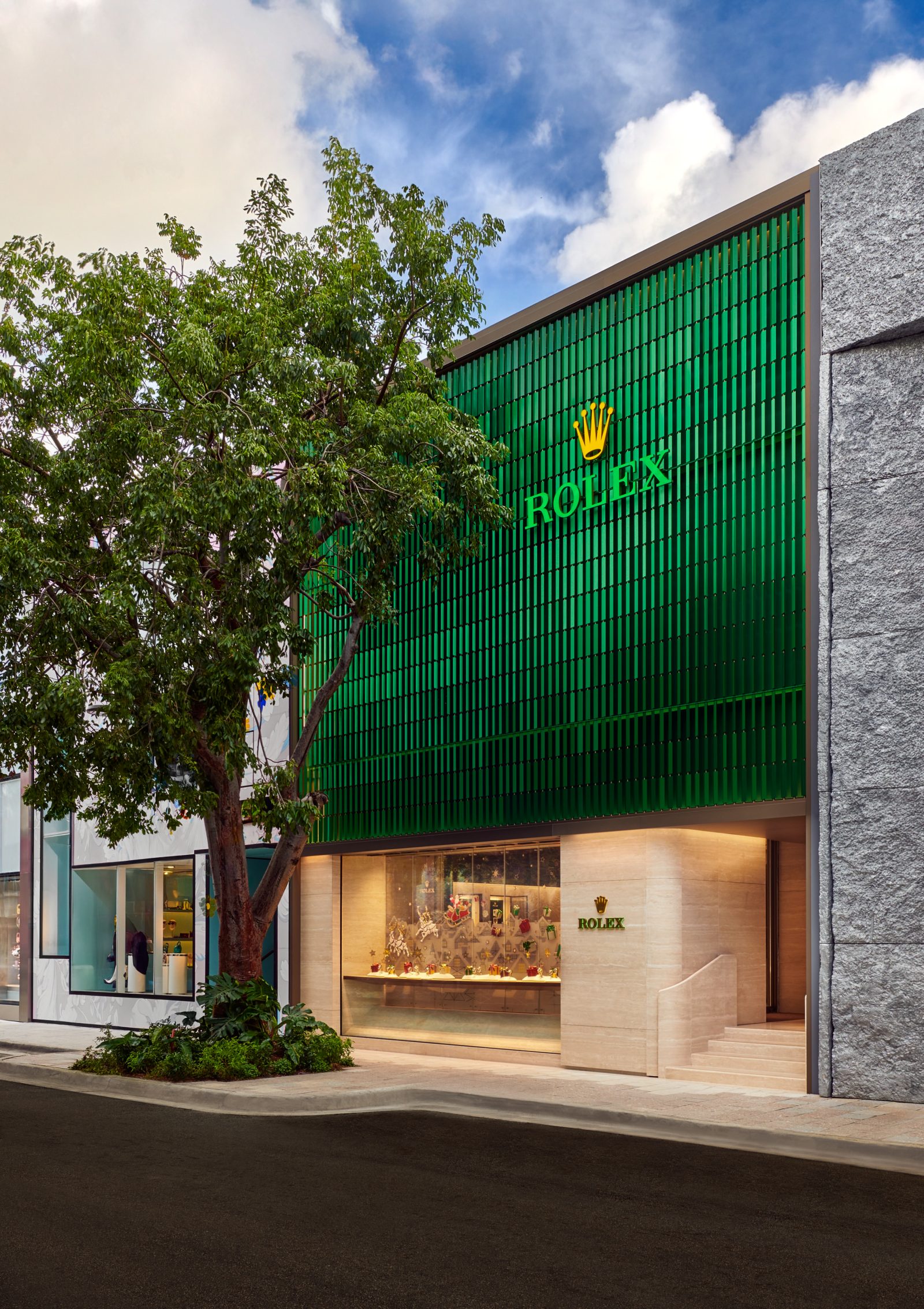 Exterior of Luxury Swiss Boutique’s two-level showroom in Miami Design District with signature green façade