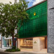 Exterior of Luxury Swiss Boutique’s two-level showroom in Miami Design District with signature green façade