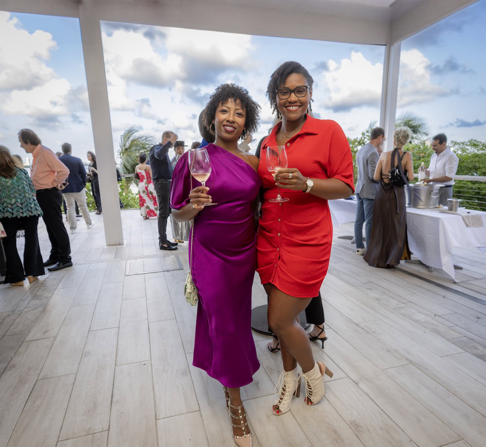 17 guests with wine biscayne backdrop