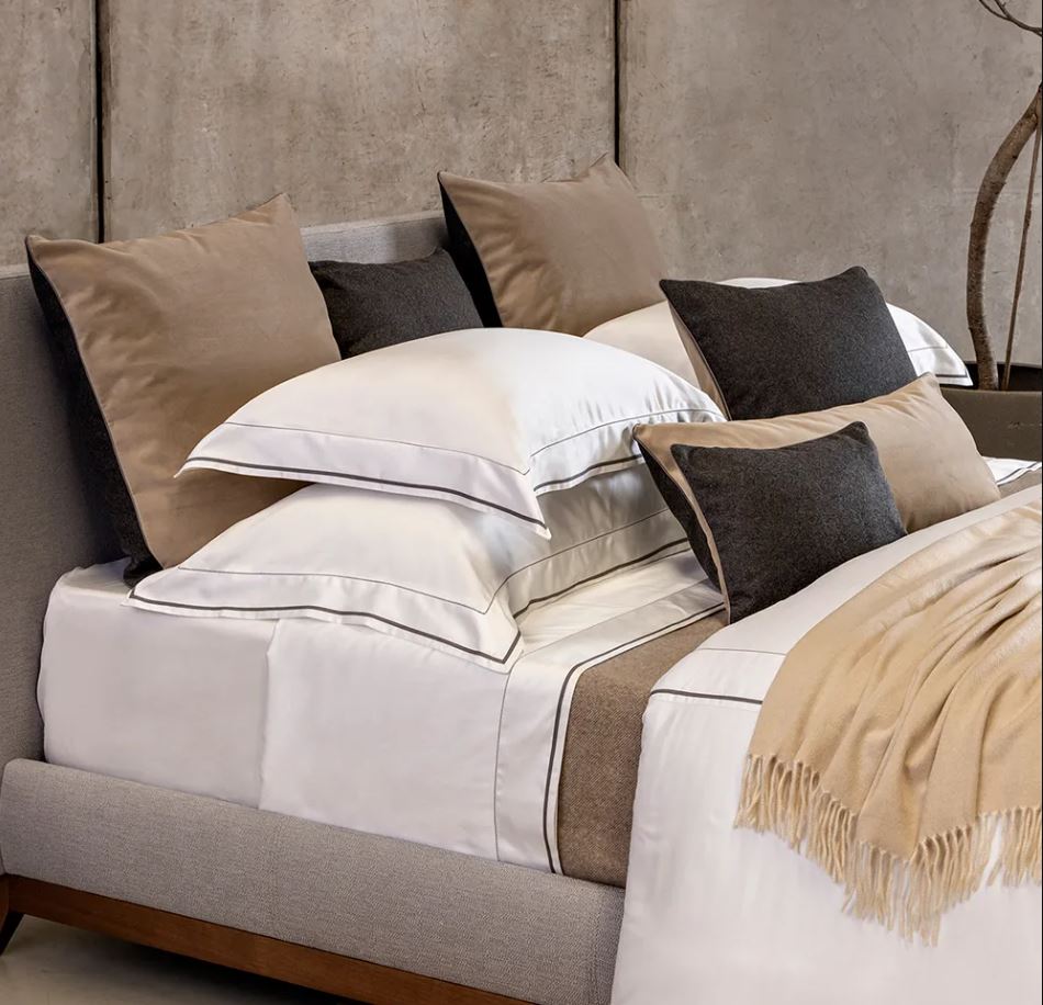 Trousseau Garda Collection bedding with taupe accents, layered sheets, and smooth upscale cotton textures