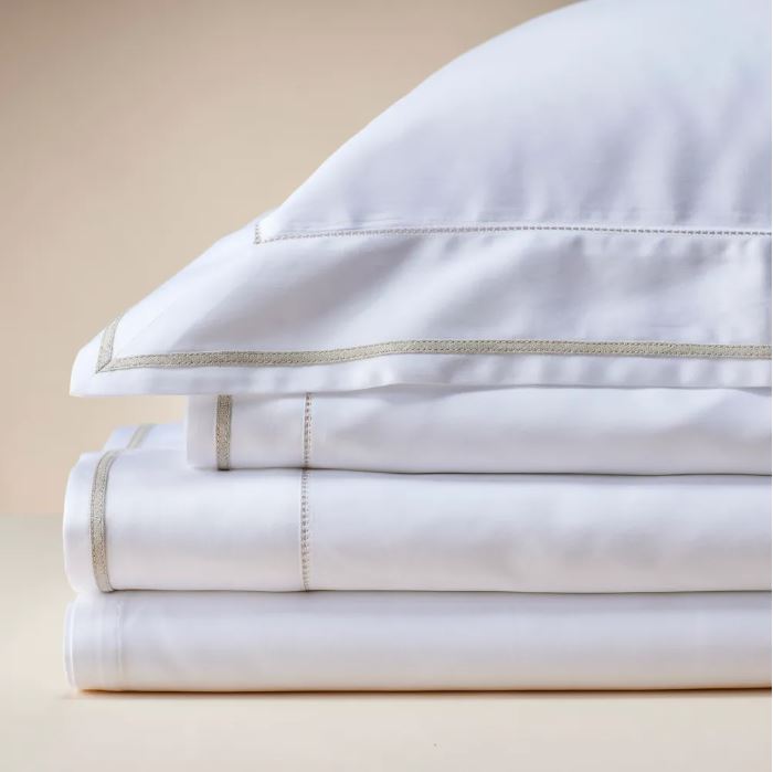 Trousseau Garda Collection white bedding with grey border trim and crisp embroidered sheet detail