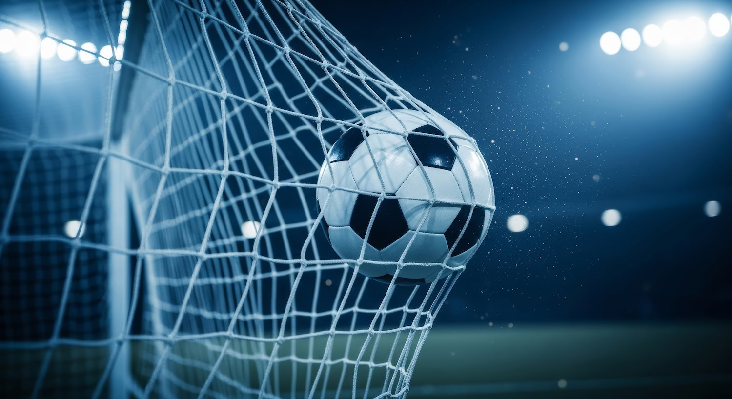 soccer,ball,scoring,a,goal,in,a,stadium,net,at