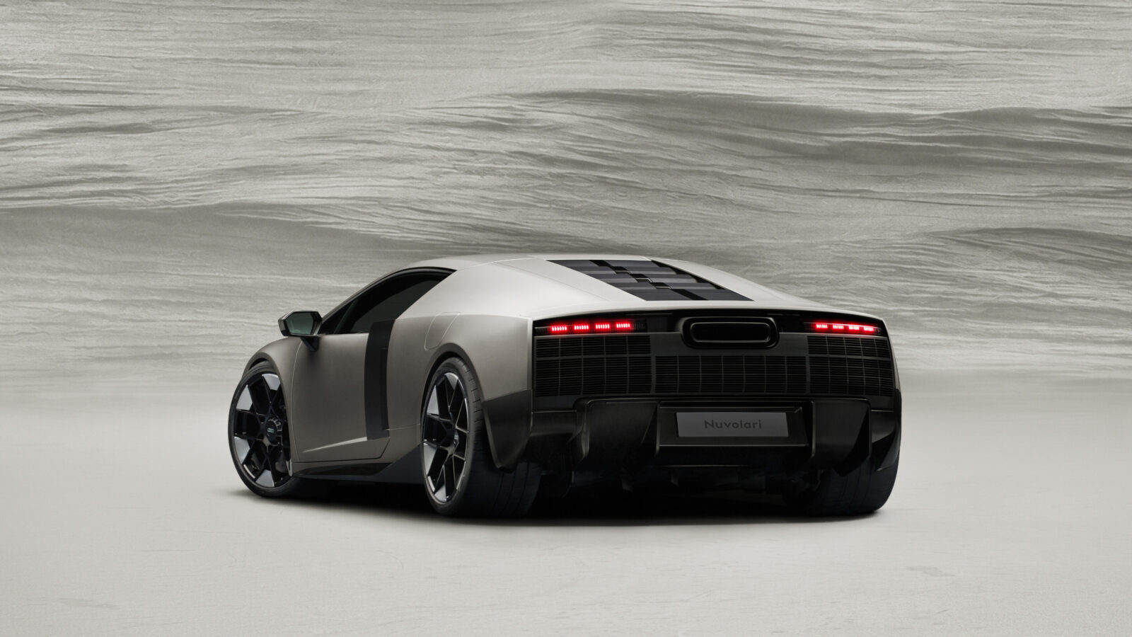 Titanium, static studio shot, exterior, rear three-quarter view