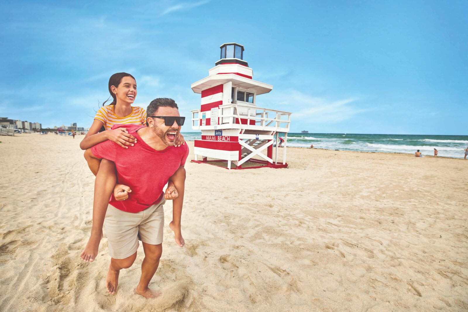 family photo with tower beachfront south beach credit gmcvb