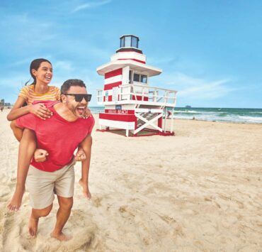 family photo with tower beachfront south beach credit gmcvb