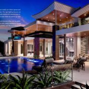Modern luxury home exterior with architectural lighting fixtures, outdoor LED lighting, and integrated smart home technology by Sound & Vision Technology