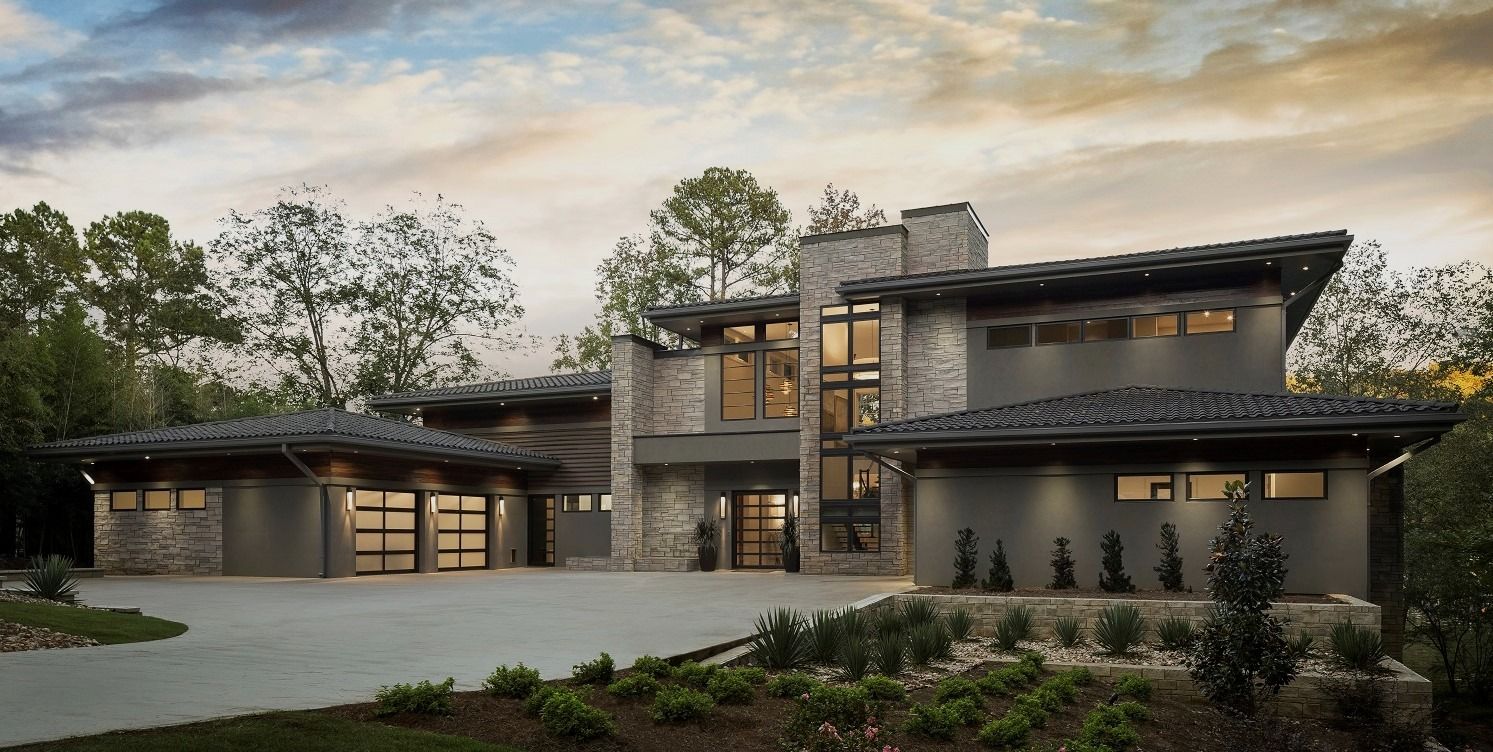 Modern luxury home exterior with integrated smart home lighting and automation by Sound & Vision Technology