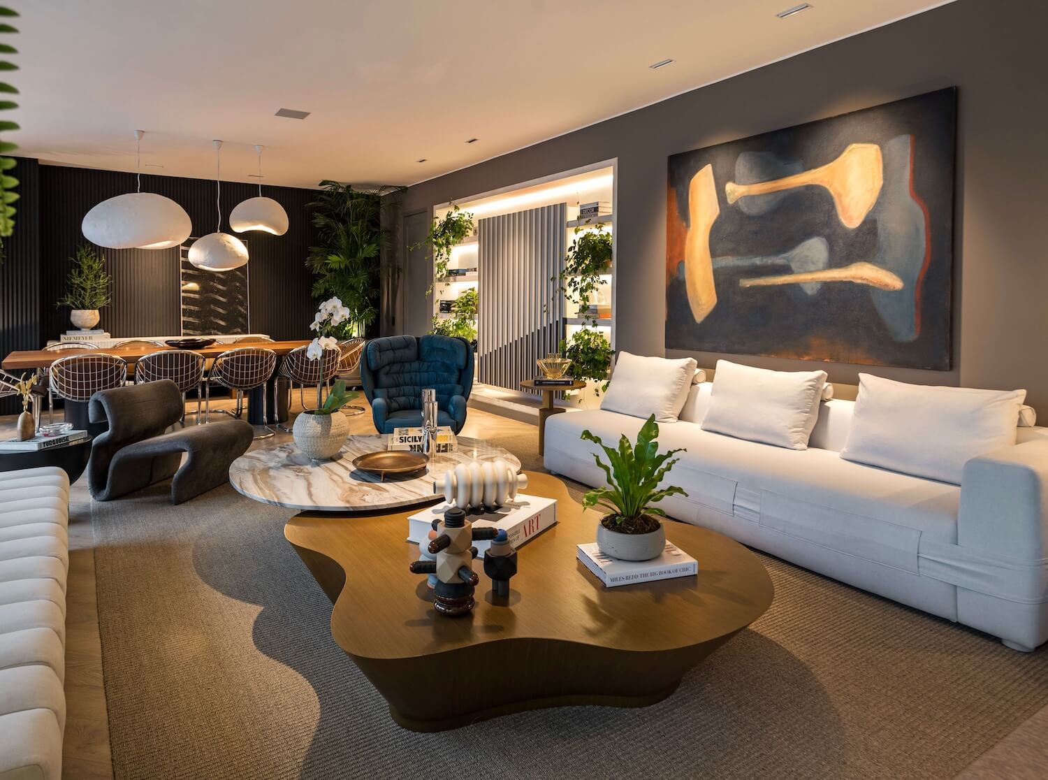 Trazzo luxury lounge lighting design with pendant lighting, art lighting, recessed ceiling lights, and warm residential interior illumination.