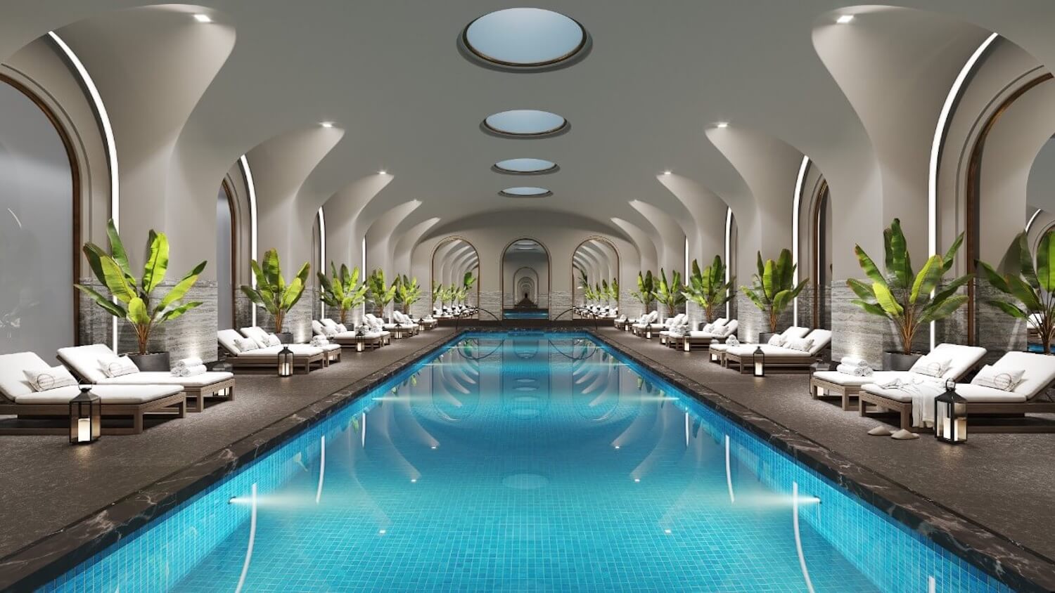 Trazzo luxury pool and spa lighting design with illuminated arches, underwater pool lights, lounge areas, and hospitality-style ambiance.