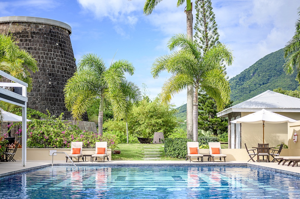 Swimming pool surrounded by tropical gardens at Montpelier Plantation & Beach in Nevis