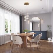 Minka Bollavino LED pendant lights in an elegant dining room with a wood table, upholstered chairs, and wall sconces.