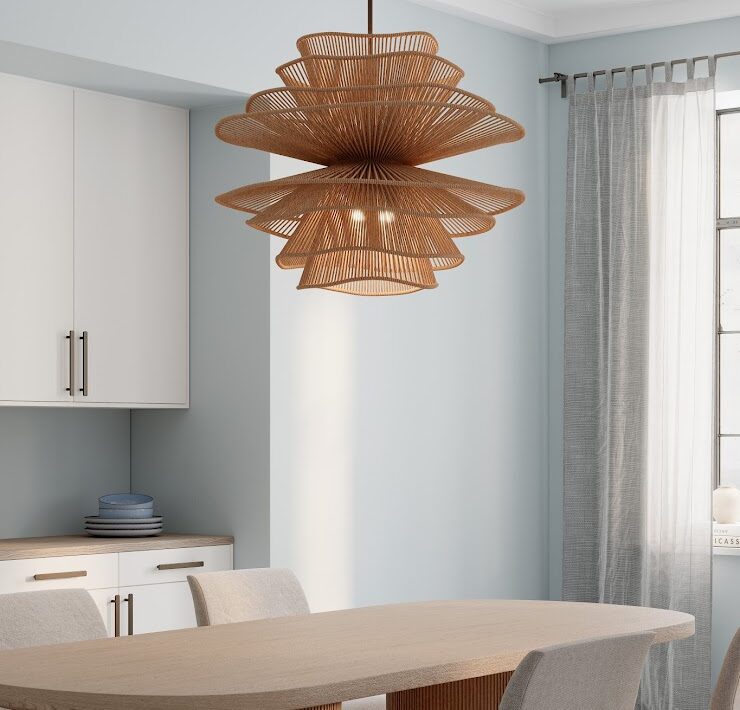 Minka Mireth woven pendant light above a dining table in a bright room with pale blue walls and soft neutral finishes.
